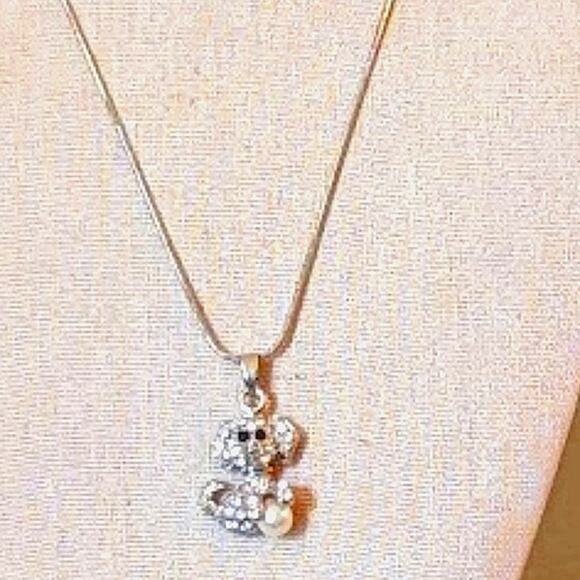Rhinestone Dog Playing with a Pearl Ball Necklace - Picture 1 of 5
